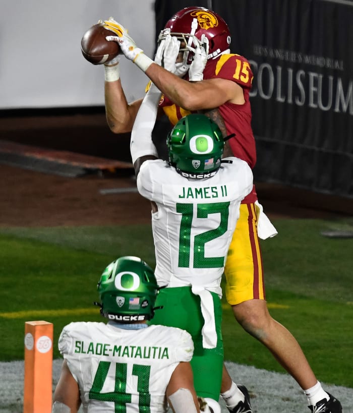 DJ James (12) breaks up a pass intended for wide receiver Drake London (15) against the USC Trojans in the 2020 Pac-12 Championship Game.